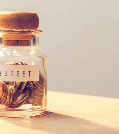 Jar of change that says "Budget"