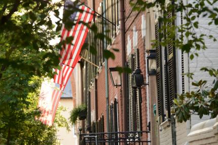 building facades with American flag in Old Town Alexandria Virginia 