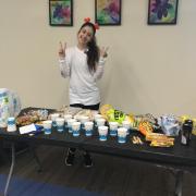 Photo of participant smiling at snack table.