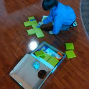 Boy putting together a maze