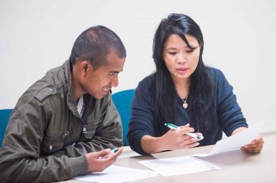 Man and woman reviewing papers