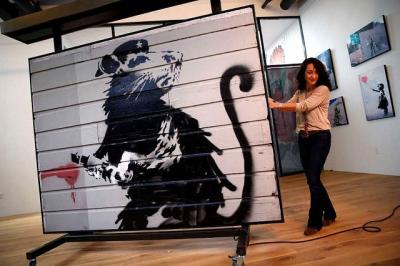 The Kokomo-Howard County Public Library (IN) will become what is thought to be the first library in the world to host a piece of art by the street artist Banksy.