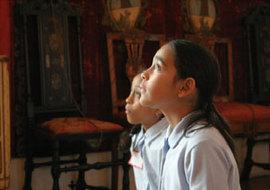 Two elementary students with “eyes on canvas” at the Isabella Stewart Gardner Museum.