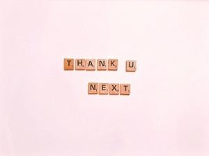 Scrabble tiles that read "Thank U Next"