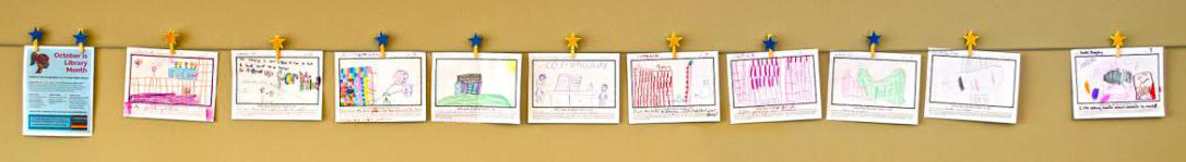 Children's drawings hung up on the wall