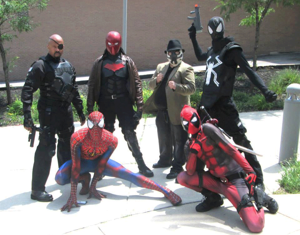 6 adults cosplaying Nick Fury, Jason Todd, Rorschach, Spiderman (symbiote costume), Spiderman, and Deadpool