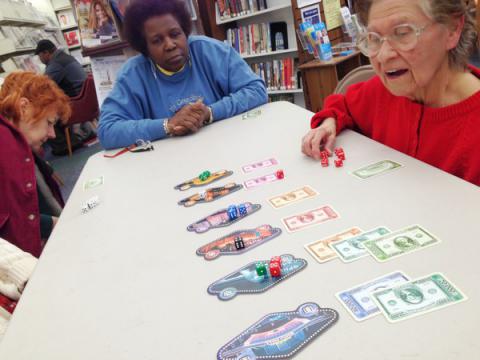 Seniors playing a board game