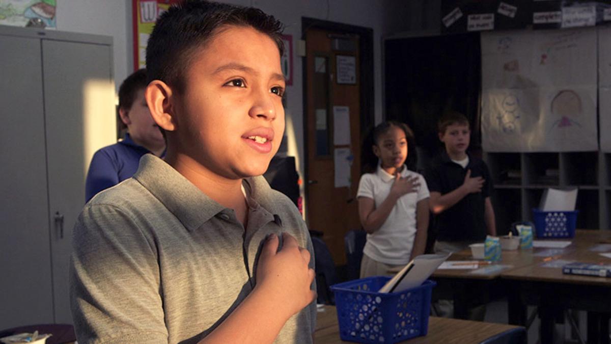 A student pledges allegiance to the flag in "American Creed," a PBS documentary that profiles citizen-activists around the country.