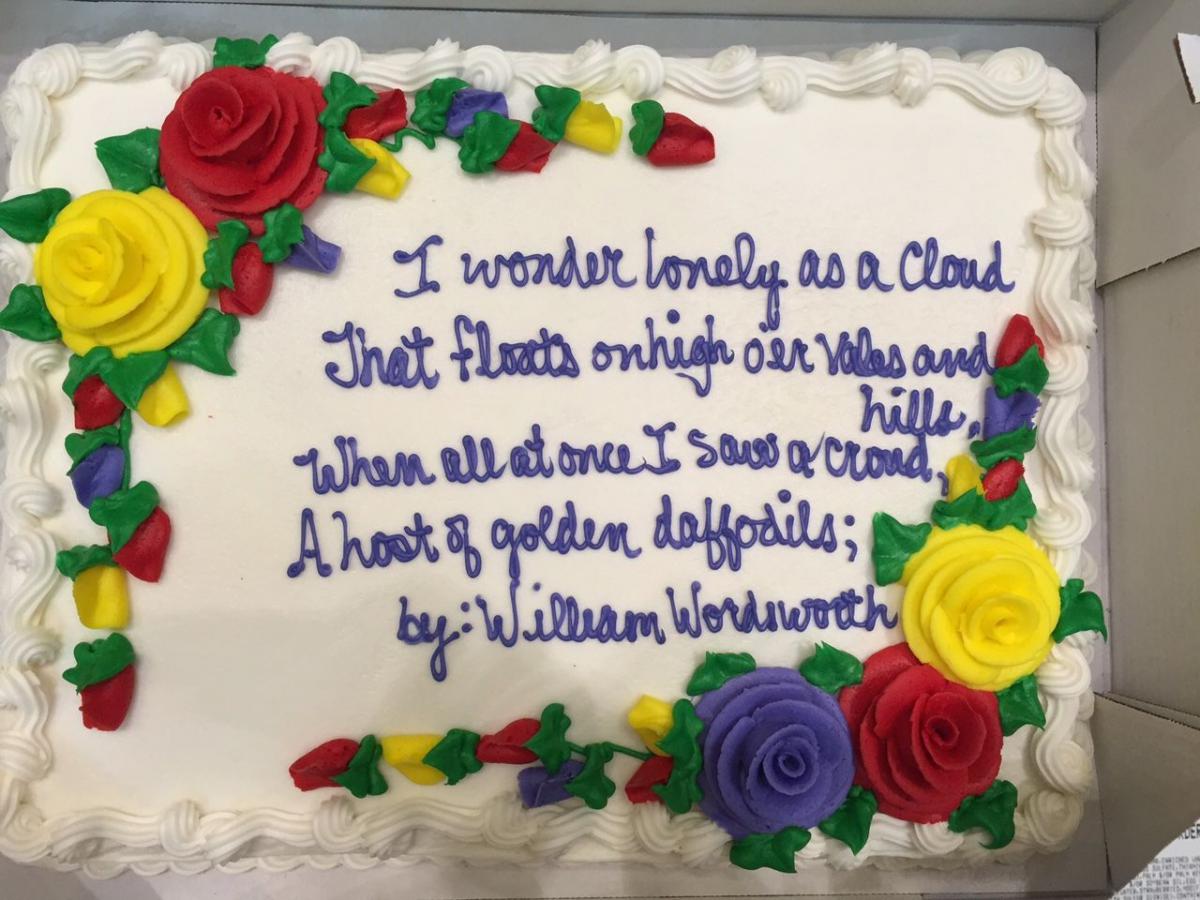 sheet cake with a poem written in icing