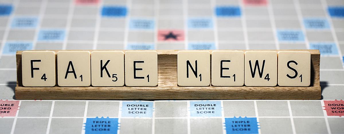 Scrabble tiles that spell "Fake News"