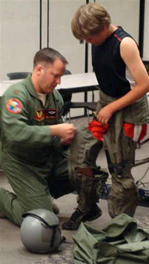 An F-16 pilot from a local military facility, Camp Dodge, spoke about his experiences and brought his equipment for everyone to try on at Johnston Public Library.