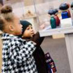 Children looking at Nativity