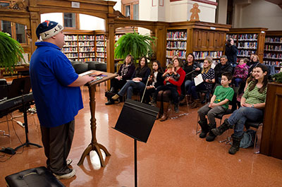Man reading to a crowd