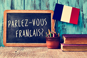 Chalkboard reading "Parlez-vous Francais?"