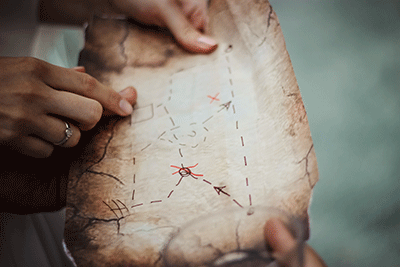Hands holding a treasure map