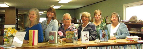 A group of women lined up in a library