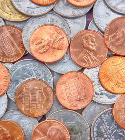 spread of coins (quarters, dimes, nickels and pennies)