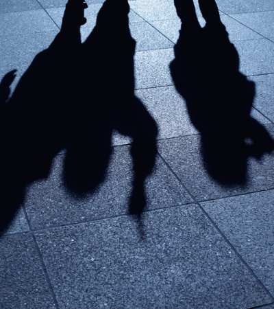 Shadowy figures on concrete
