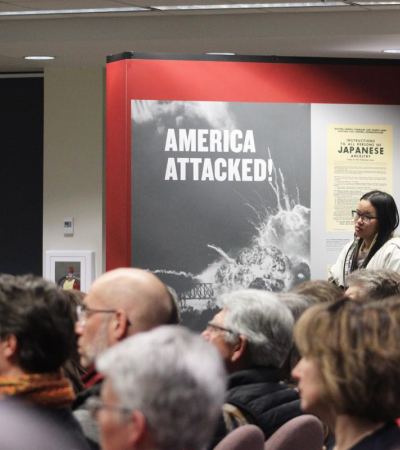 Photograph of a group of people attending a program at the Americans and the Holocaust exhibition
