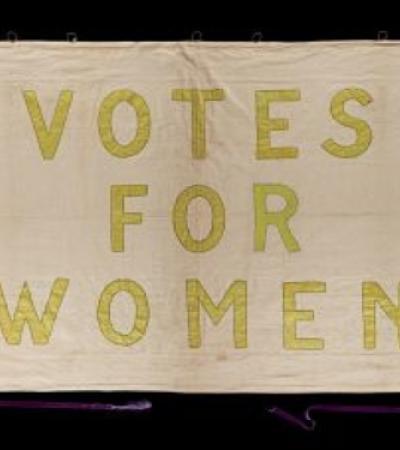 Photograph of an old 'Votes for Women' poster.