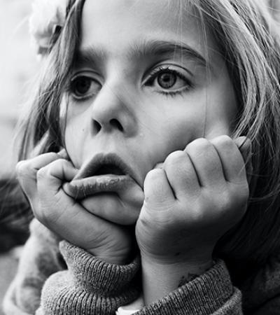 A grayscale photo of an exasperated-looking girl