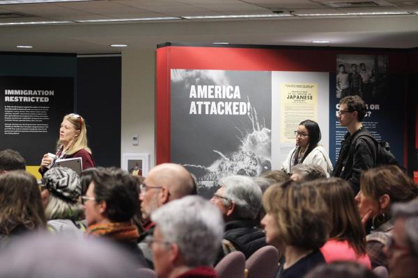 Photograph of a group of people attending a program at the Americans and the Holocaust exhibition