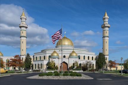 Islamic Center of America mosque with American flag in front