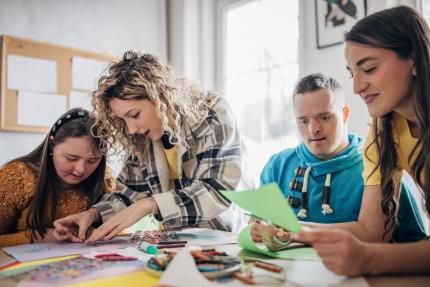 Photograph of people doing an art project 