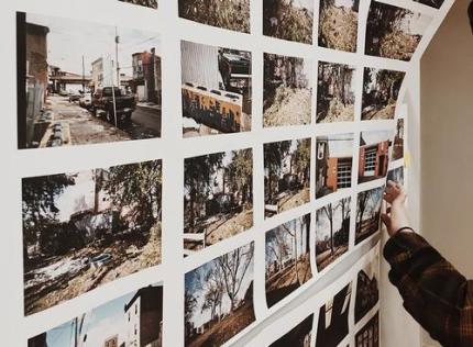 Rows of photos on a wall