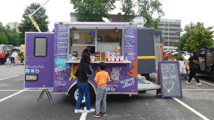 Mother and son ordering at a food truck