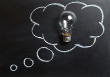 A thought bubble is drawn around a light bulb on a chalkboard. A thought bubble is drawn around a light bulb on a chalkboard.