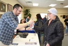 A community member tests her grip at the library's Family Health and Safety Fair. A community member tests her grip at the library's Family Health and Safety Fair.