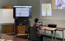 Photograph shows librarian conducting the virtual portion of the program on Zoom.