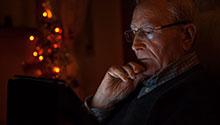 Community Engagement: Healthy Living Outreach for Seniors Man looking at tablet