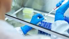 Photo of a scientist working in lab.