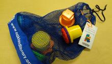 Toy in Oakland Public Library bag