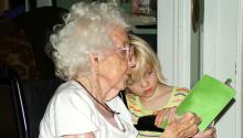 Grandparent's Day Granddaughter and grandmother reading together