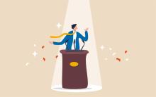 Illustration of a person speaking at a podium under a spotlight.