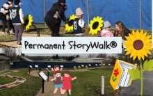 Two photographs of the outdoor StoryWalk. Text reads: Permanent StoryWalk. There are illustrations of a sunflower, book, and family of three.
