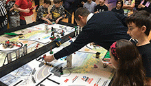 FLL teams prepare their robots FLL teams prepare their robots