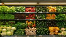 Photograph of vegetables in a grocery store.