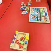 Photograph of a Manipulation Station table with wooden puzzles