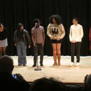 Six students perform at the World on the Move Poetry and Spoken Word event