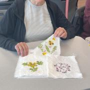 A program participant displays finished flower dye