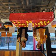 The Finals Fairy Table. Two people pose at a table with bananas and oranges.
