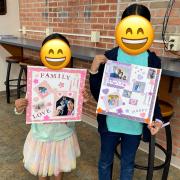 Two patrons show off their final scrapbooks