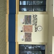 Wall display with text "Australian Artists" and 3 paintings 