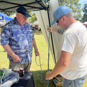 Two people tying knots