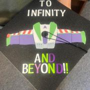 Grad Cap with a Buzz Lightyear graphic and text "To Infinity and Beyond!!"