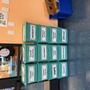 Stacked green boxes labeled with names of local establishments